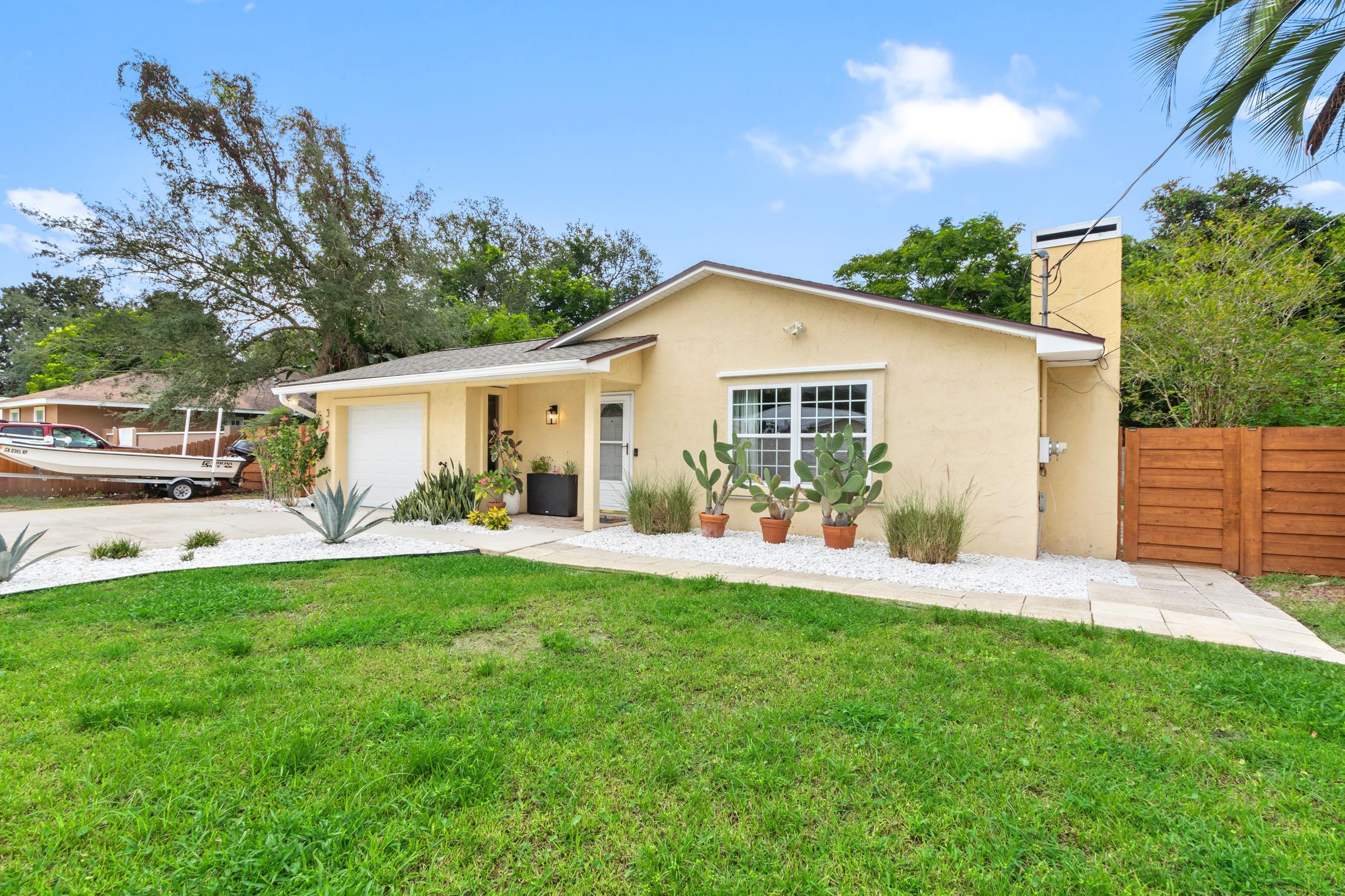 359 Shamrock Road St. Augustine, FL 32086 - Photo 2 of 39 a view of a house with a yard and sitting area