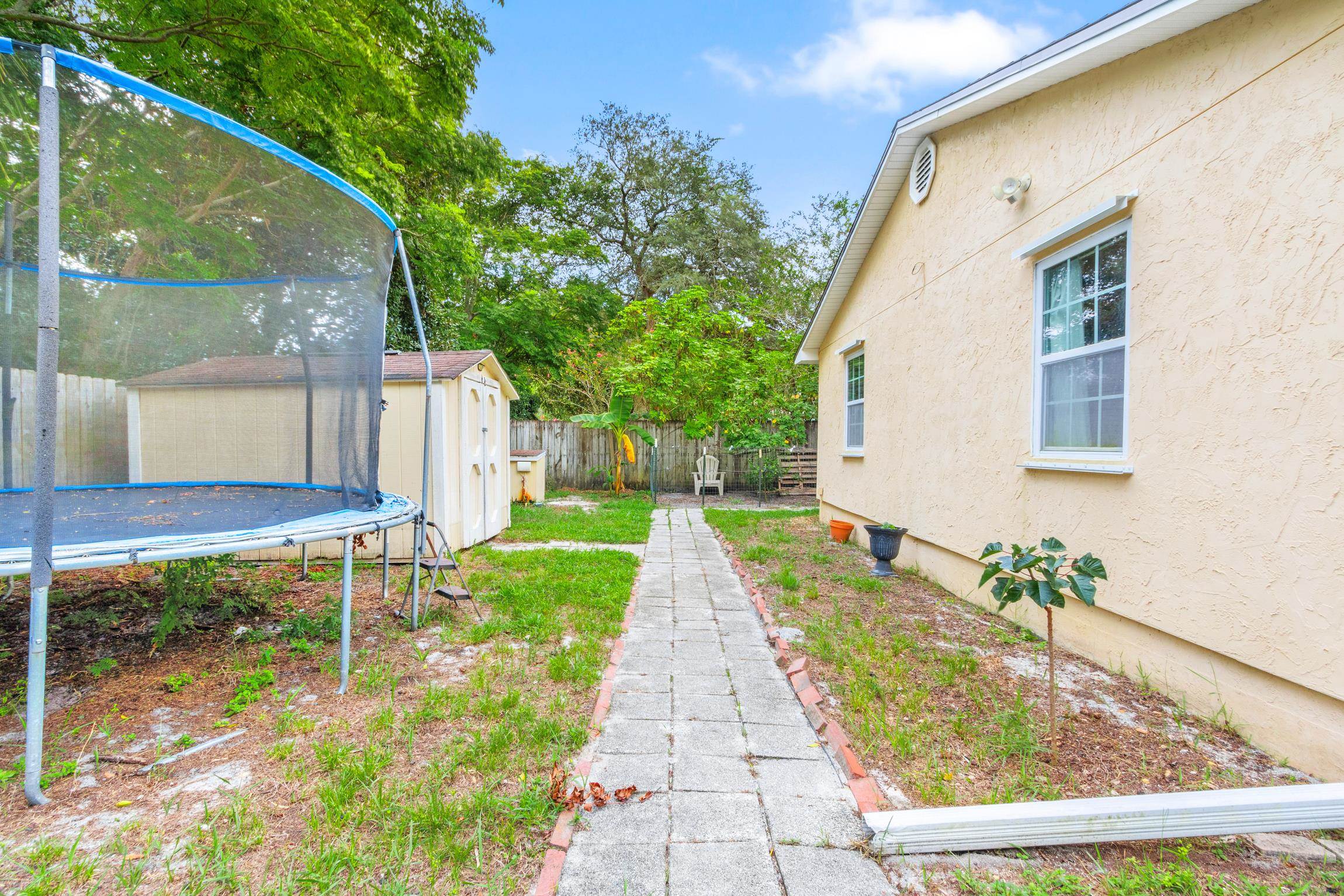359 Shamrock Road St. Augustine, FL 32086 - Photo 26 of 39 a view of a house with backyard and sitting area