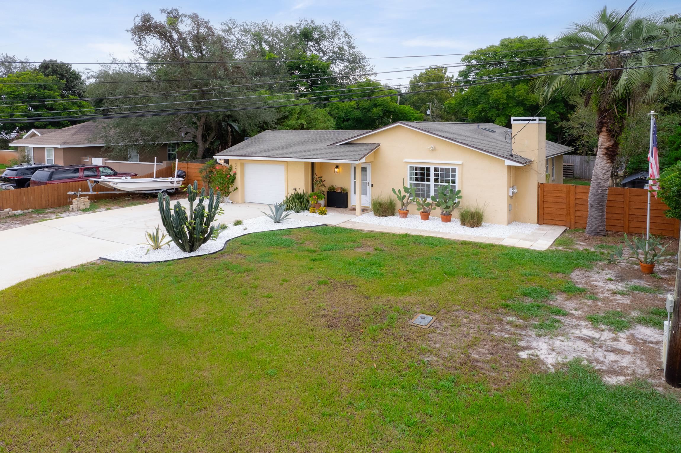 359 Shamrock Road St. Augustine, FL 32086 - Photo 29 of 39 a view of a house with backyard and sitting area