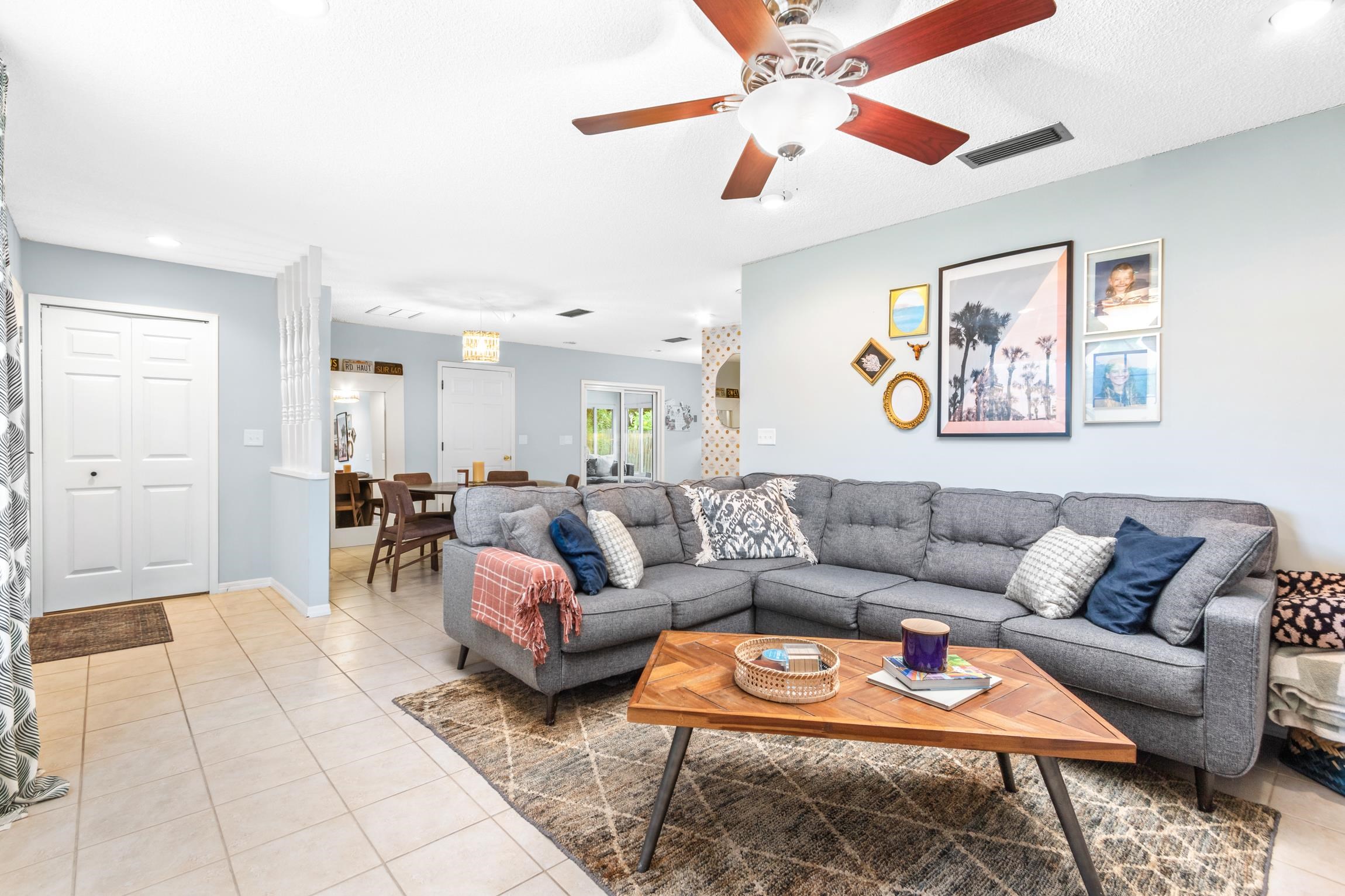 359 Shamrock Road St. Augustine, FL 32086 - Photo 8 of 39 a living room with furniture a rug and a ceiling fan