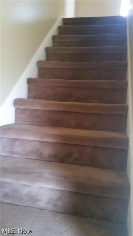 4050 Fulton Road Cleveland, OH 44144 - Photo 13 of 19 Carpeted stairs leading to second floor.