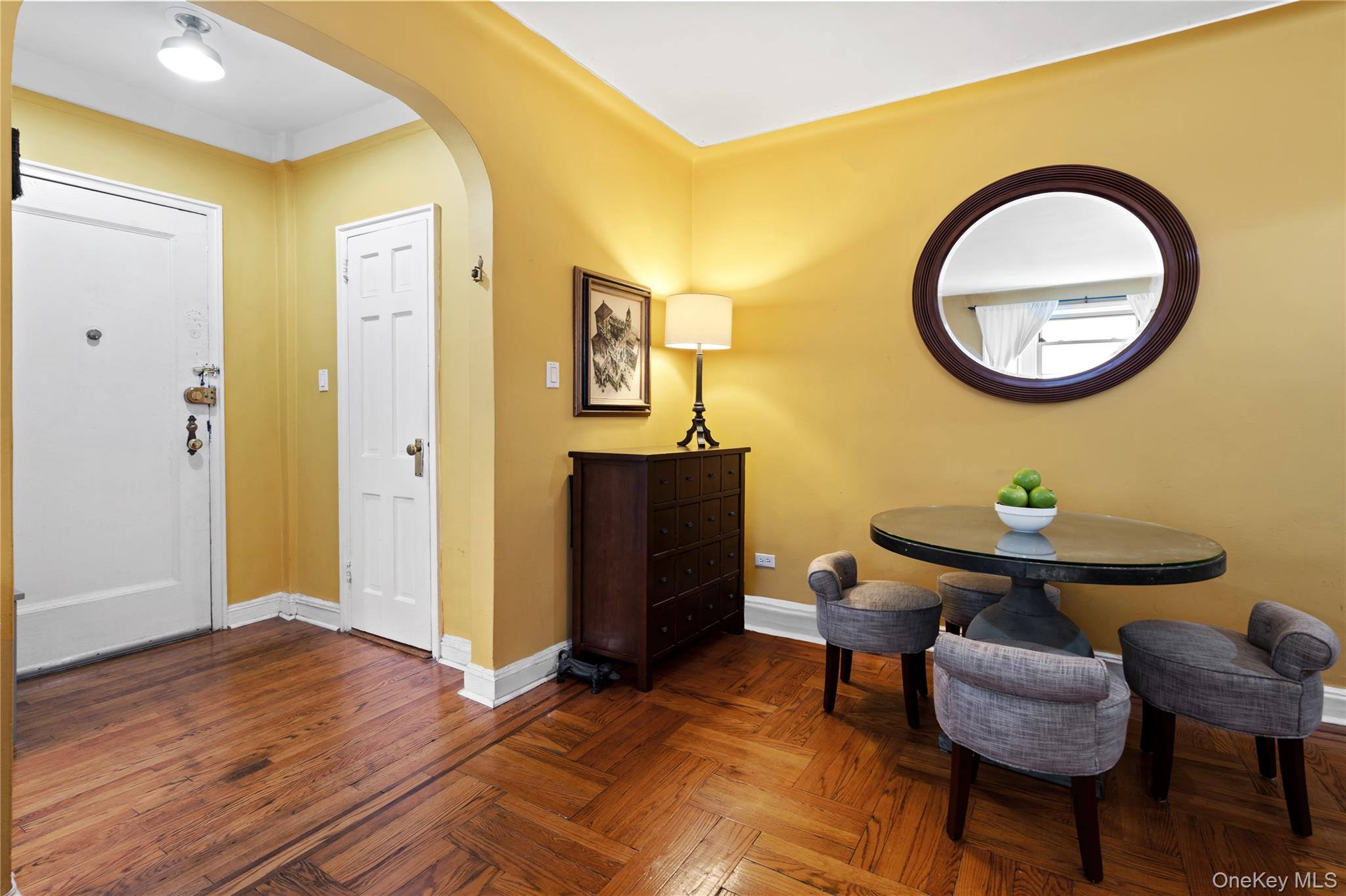 110-31 73rd Road, Unit 4N Queens, NY 11375 - Photo 5 of 15 a view of a livingroom with furniture and a wooden floor