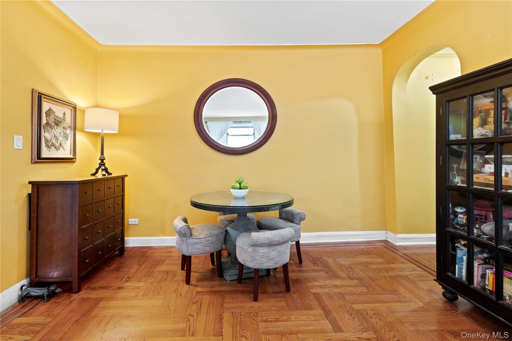 110-31 73rd Road, Unit 4N Queens, NY 11375 - Photo 6 of 15 a living room with a table and a bookshelf