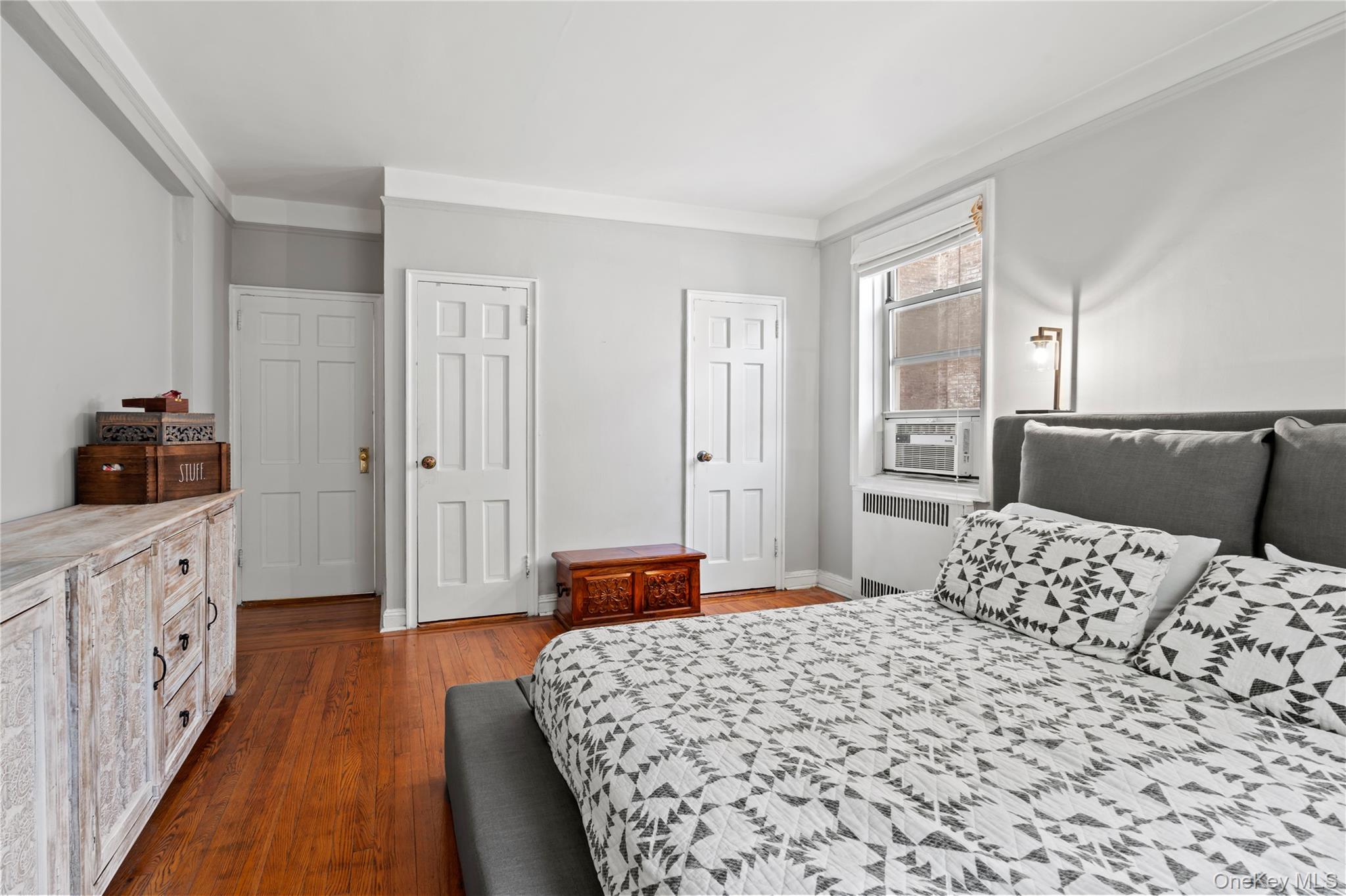 110-31 73rd Road, Unit 4N Queens, NY 11375 - Photo 10 of 15 a bedroom with a bed and a walk in closet