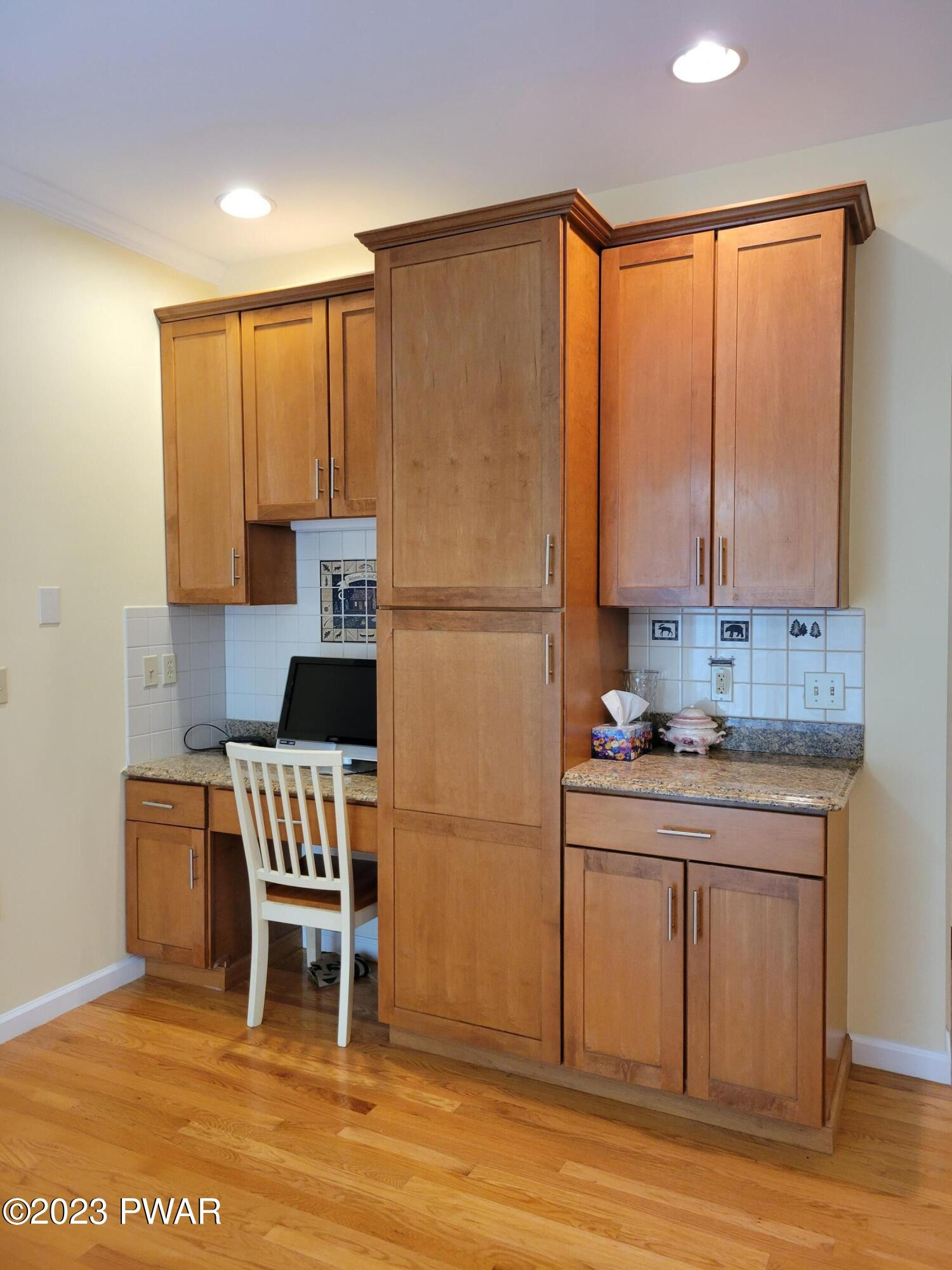 110 Rodeo Lane Hawley, PA 18428 - Photo 16 of 36 a kitchen with a refrigerator a stove top oven and white cabinets
