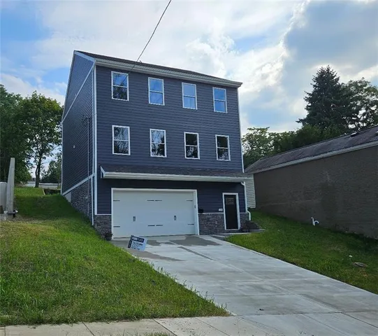 front view of a house with a yard