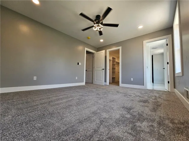 a bathroom with a shower and a sink