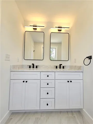 en empty room with wooden floor and windows