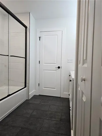 a bathroom with a double vanity sink and mirror