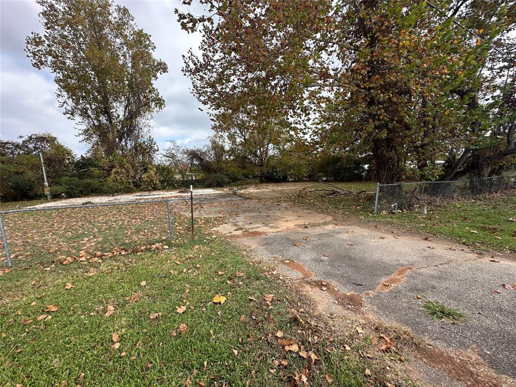 5410 Benton Road Bossier City, LA 71111 - Photo 4 of 4 a view of a field with trees in the background
