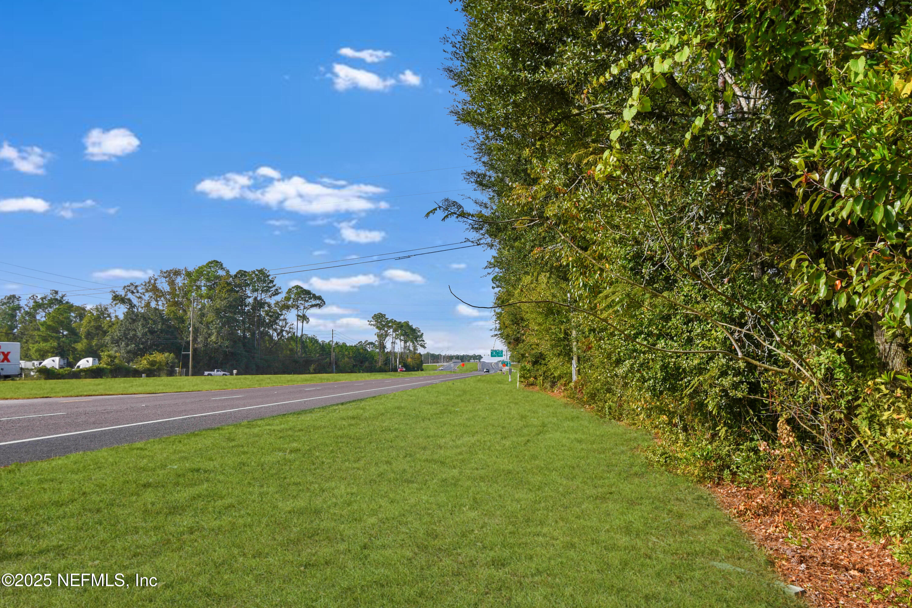 11595 Normandy Boulevard Jacksonville, FL 32221 - Photo 12 of 13 a view of a big yard with an outdoor space and seating