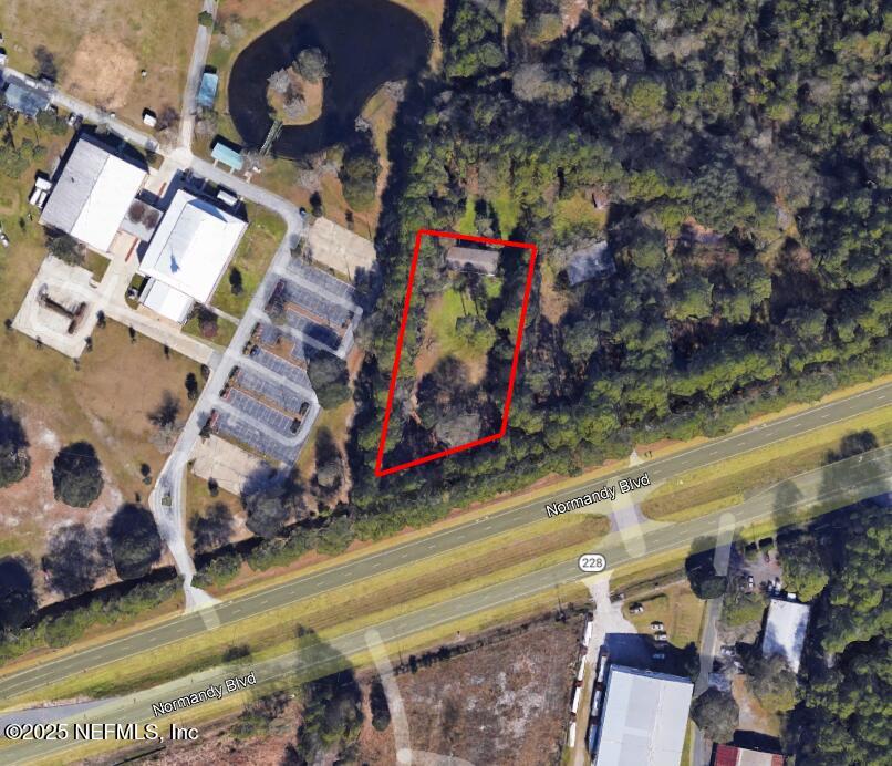 11595 Normandy Boulevard Jacksonville, FL 32221 - Photo 2 of 13 a view of multiple houses with yard