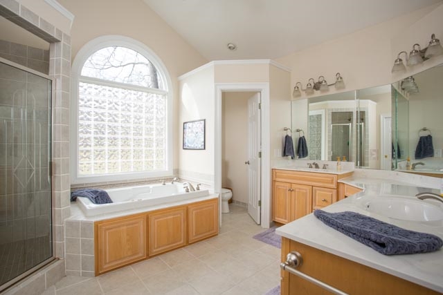 3731 Davis Road Penn Laird, VA 22846 - Photo 20 of 49 a spacious bathroom with a granite countertop tub sink and mirror