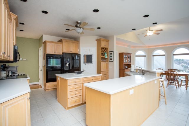 3731 Davis Road Penn Laird, VA 22846 - Photo 5 of 49 a large kitchen with kitchen island a large counter space a sink appliances and cabinets