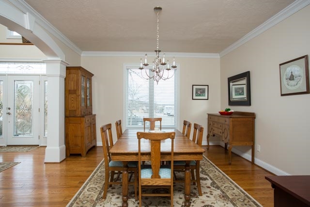 3731 Davis Road Penn Laird, VA 22846 - Photo 10 of 49 a dining room with wooden floor and a chandelier
