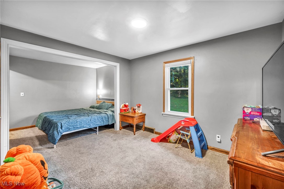 6984 Warren - Sharon Road Brookfield, OH 44403 - Photo 34 of 46 Bedroom with light colored carpet and baseboards