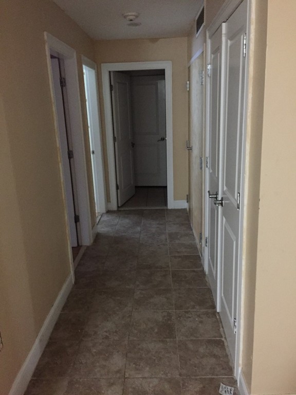 25 Alpine Street, Unit 1 Boston, MA 02136 - Photo 9 of 9 wooden floor in a gallery