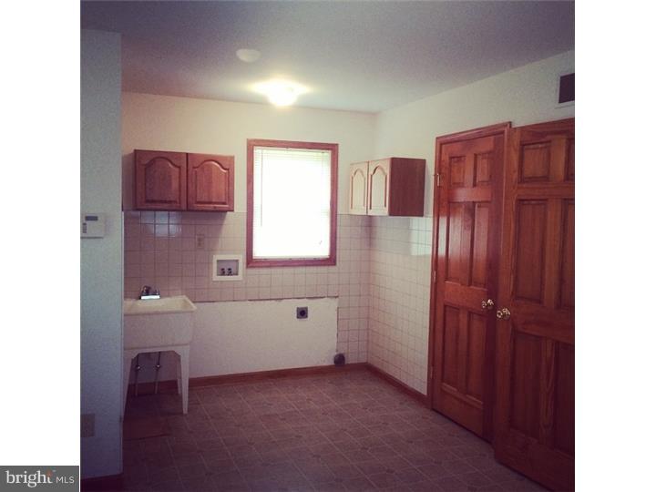 241 Weymouth Road Buena, NJ 08310 - Photo 2 of 21 a bathroom with a bathtub a sink and a window