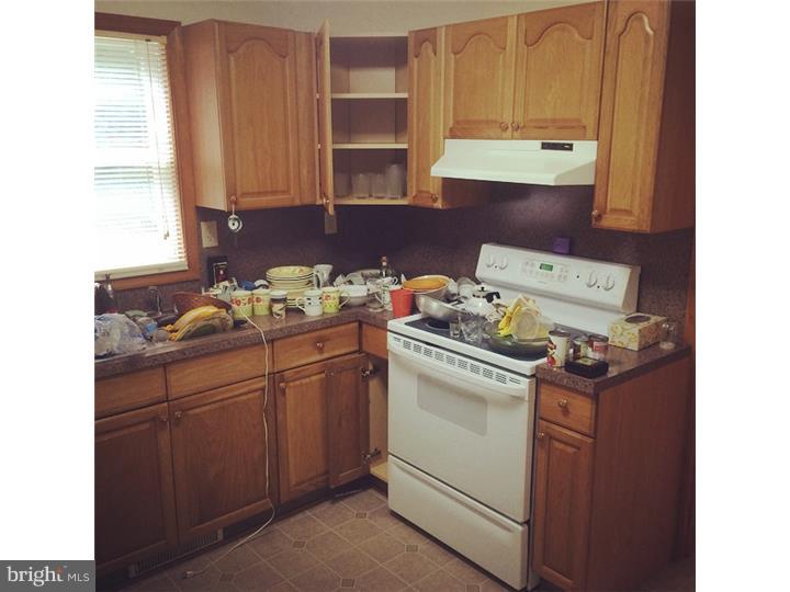 241 Weymouth Road Buena, NJ 08310 - Photo 4 of 21 a kitchen with granite countertop cabinets and white appliances