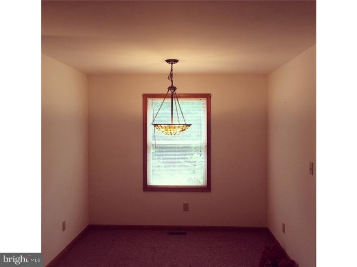 241 Weymouth Road Buena, NJ 08310 - Photo 6 of 21 a window in an empty room