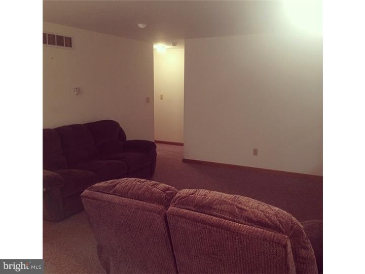 241 Weymouth Road Buena, NJ 08310 - Photo 9 of 21 a living room with furniture and a potted plant