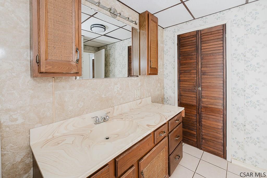 159 Wilson Street Johnstown, PA 15906 - Photo 16 of 27 a bathroom with a sink vanity and a mirror