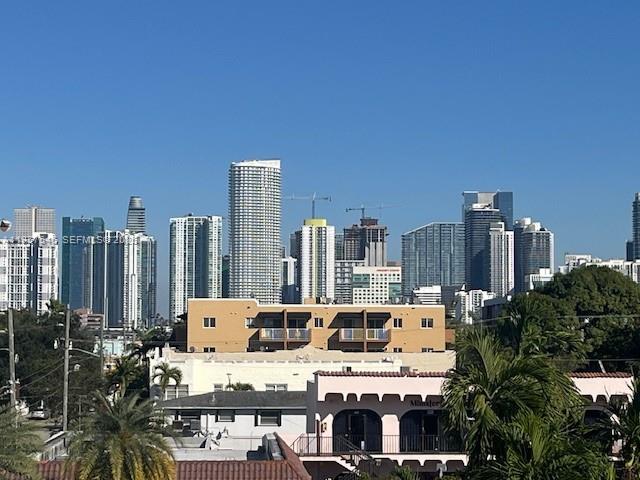 1220 Southwest 5th Street, Unit 21 Miami, FL 33135 - Photo 2 of 14 a view of city with tall buildings