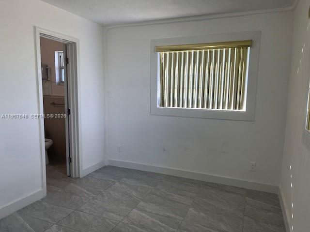 1220 Southwest 5th Street, Unit 21 Miami, FL 33135 - Photo 10 of 14 an empty room with windows