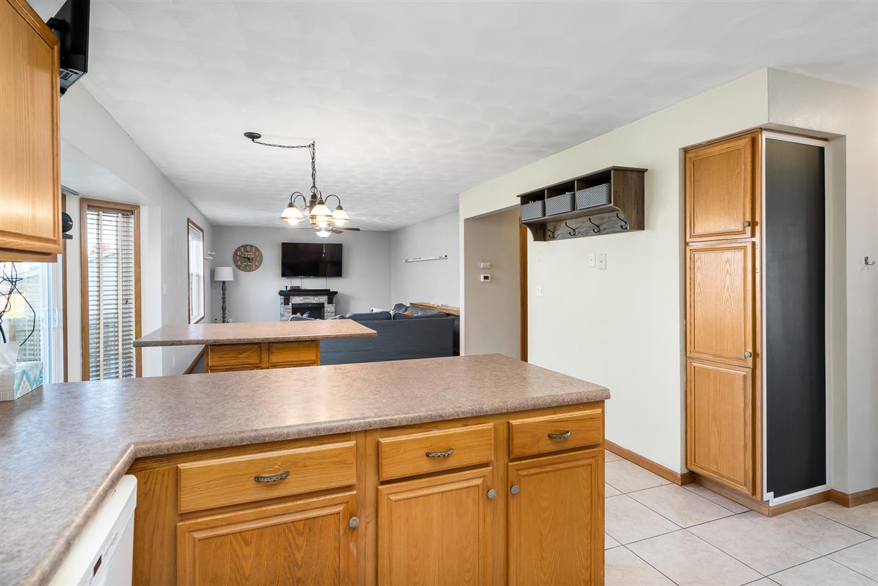 15639 Stonecrest Road South Beloit, IL 61080 - Photo 13 of 37 a view of a kitchen with refrigerator and a stove