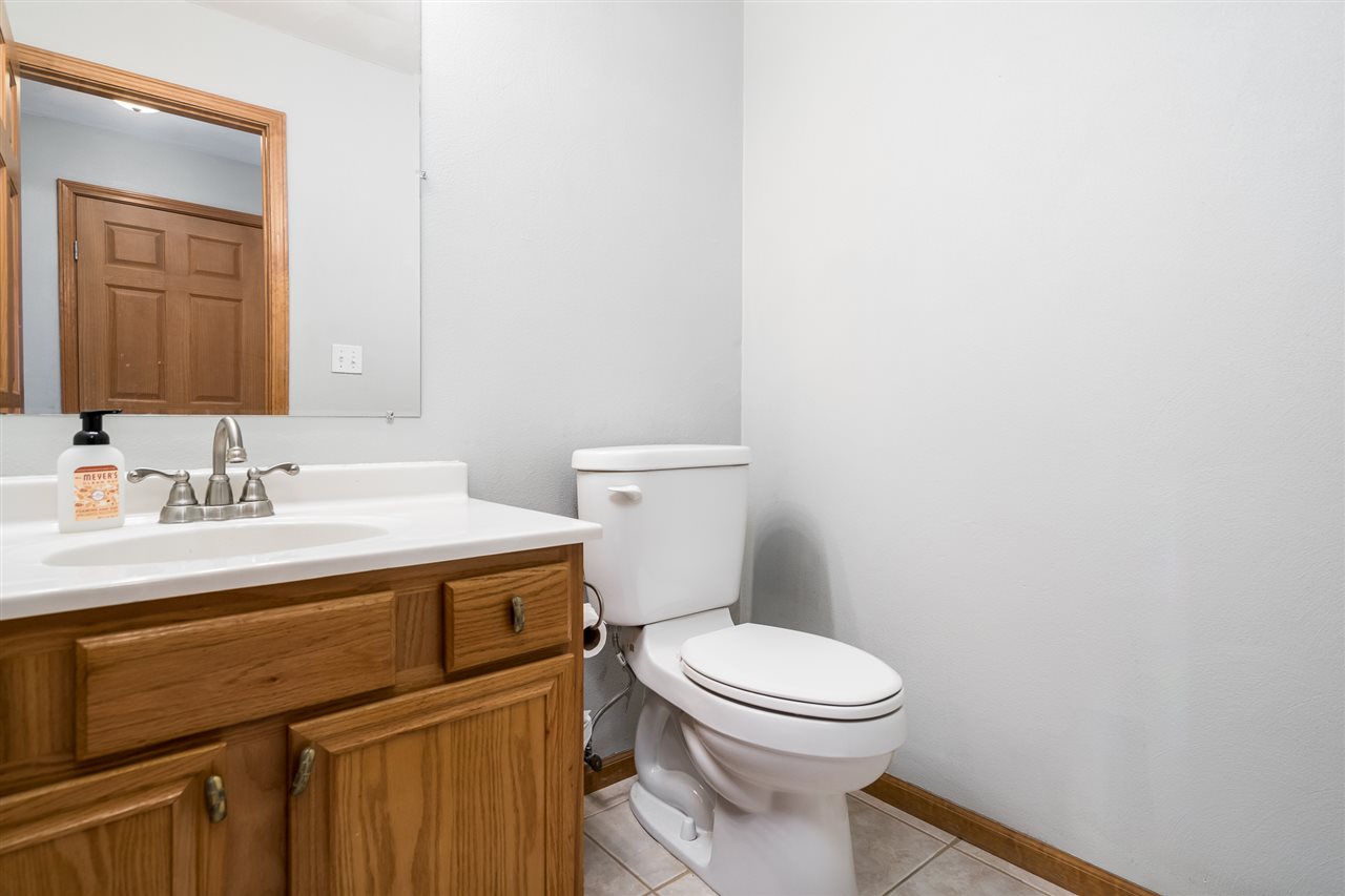 15639 Stonecrest Road South Beloit, IL 61080 - Photo 18 of 37 a bathroom with a sink a toilet and mirror