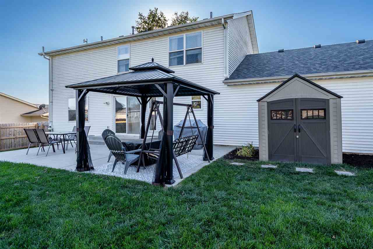 15639 Stonecrest Road South Beloit, IL 61080 - Photo 32 of 37 a view of an house with backyard and furniture