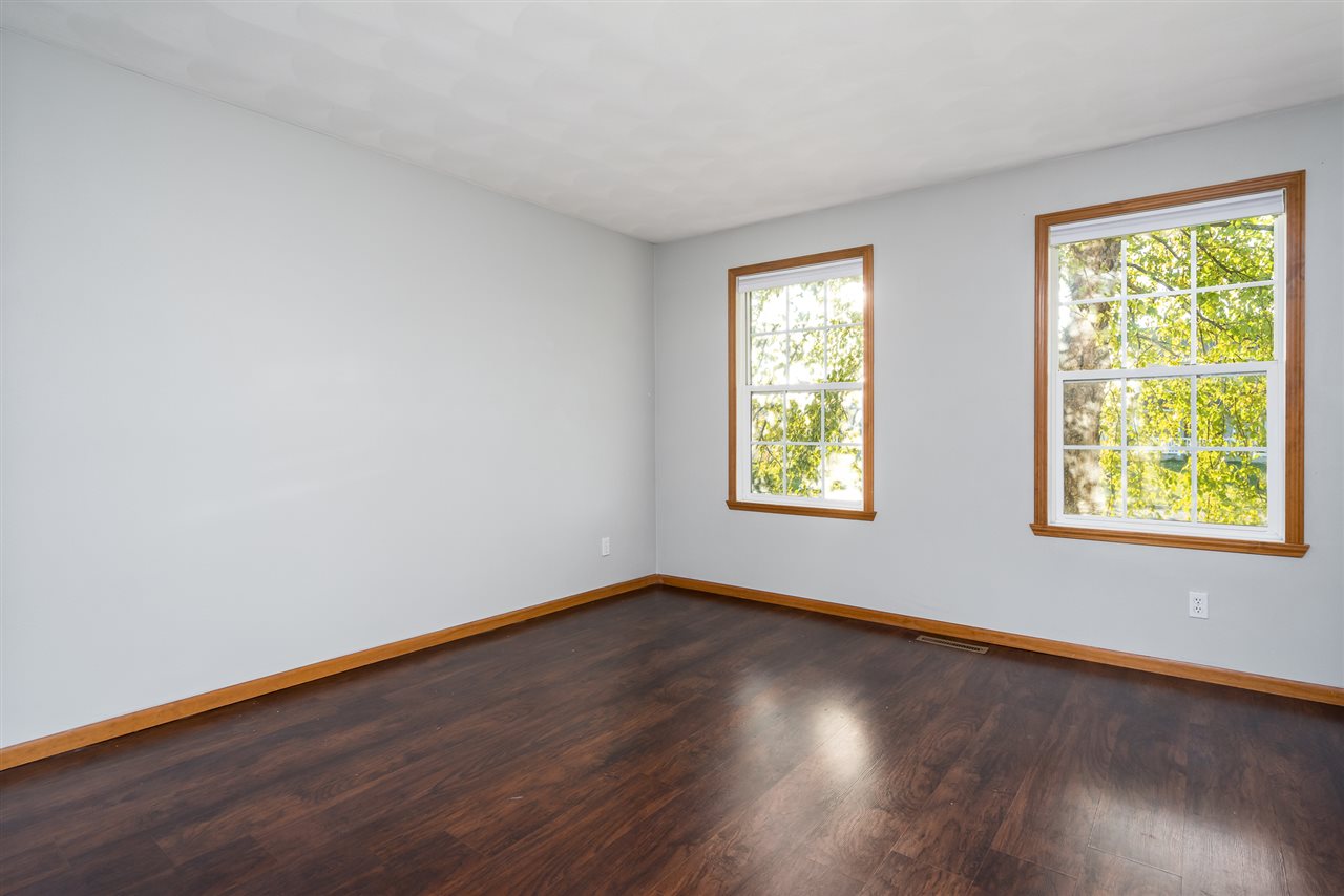 15639 Stonecrest Road South Beloit, IL 61080 - Photo 6 of 37 a view of an empty room with wooden floor and a window