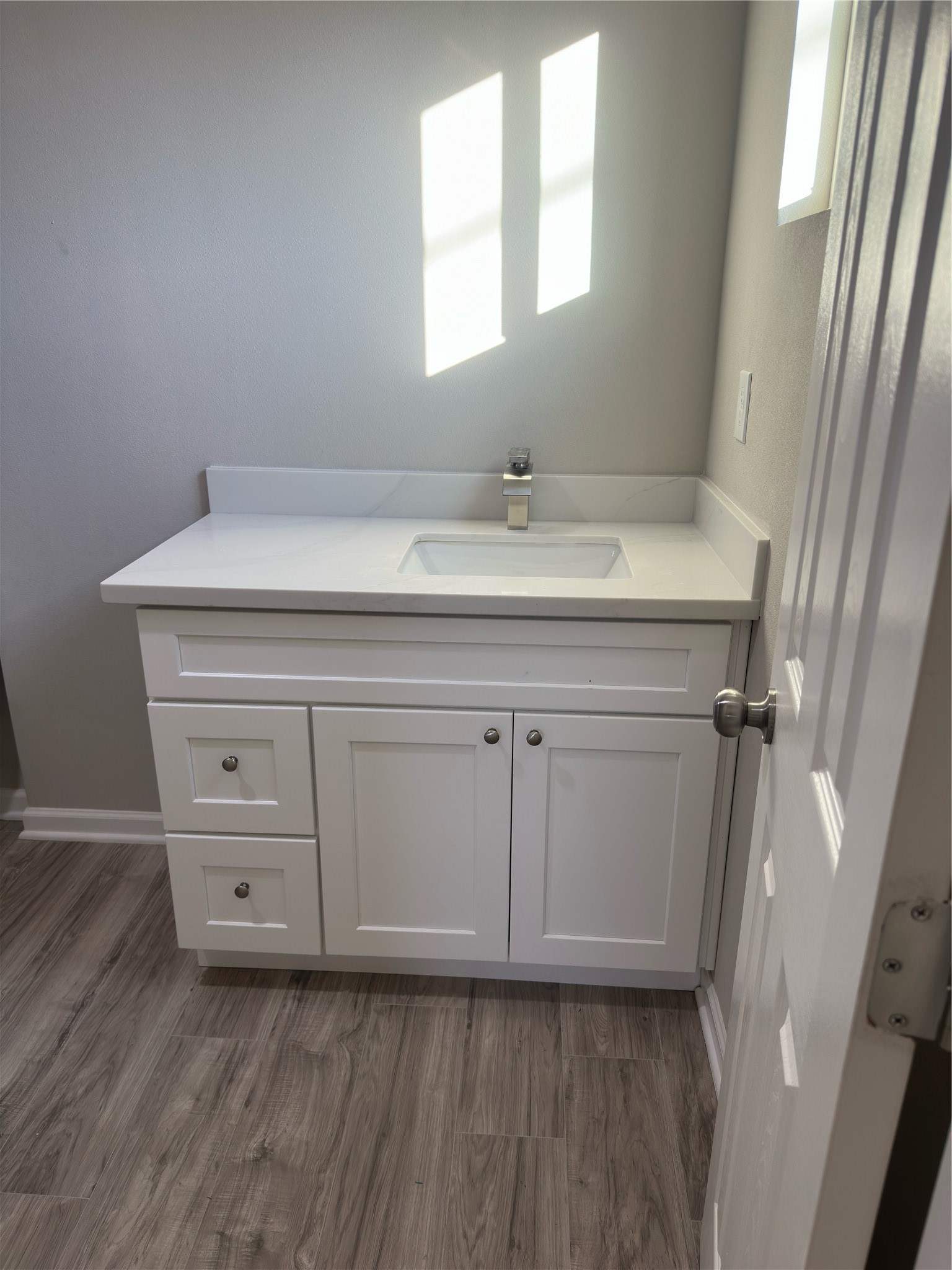 9935 Algiers Road, Unit B Houston, TX 77041 - Photo 5 of 6 a room with a sink cabinets and a window