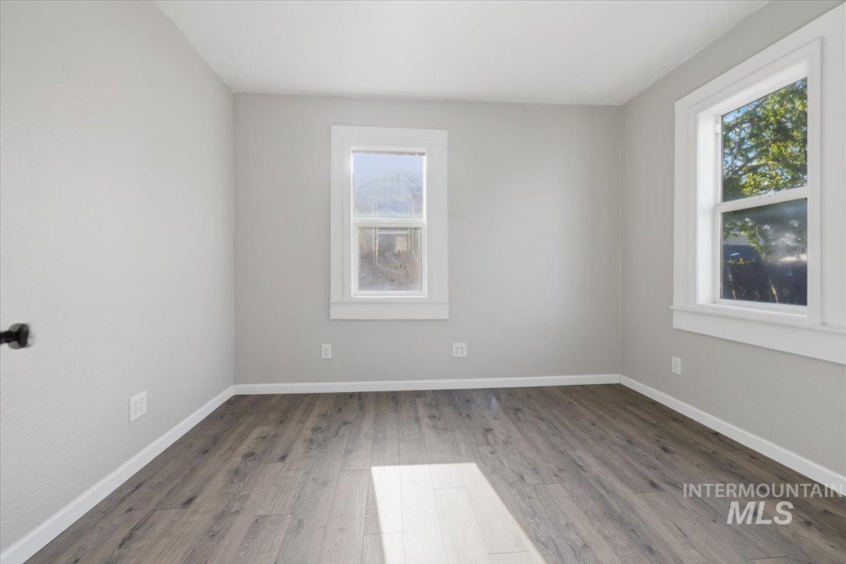 284 Fargo Avenue Notus, ID 83656 - Photo 15 of 24 Room featuring light gray walls, white trim, and wood-finish flooring