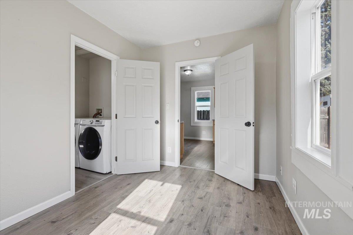 284 Fargo Avenue Notus, ID 83656 - Photo 18 of 24 Light wood-finish flooring with white baseboards throughout