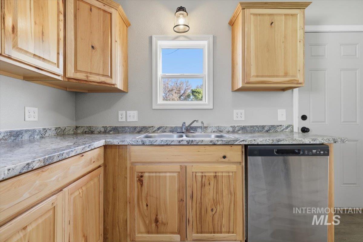 284 Fargo Avenue Notus, ID 83656 - Photo 8 of 24 Kitchen featuring wood-finish cabinetry and light-toned countertops