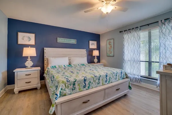 a bed room with a bed and a chandelier