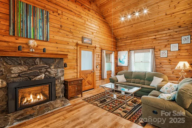 a living room with a fireplace a flat screen tv and a fireplace