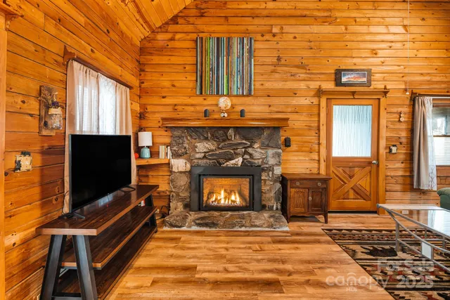 a view of a fireplace with a flat screen tv