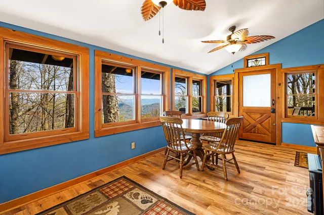 a view of a livingroom with furniture and a ceiling fan