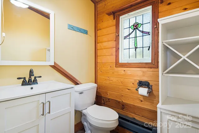 a view of staircase with a rug