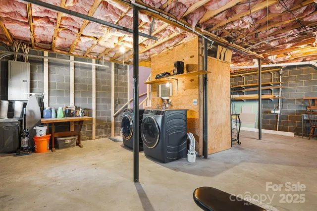 a view of a chairs and table in the roof deck