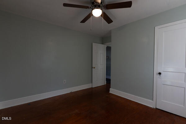 2525 Freeman Street Fayetteville, NC 28301 - Photo 14 of 24 an empty room with a ceiling fan and wooden floor