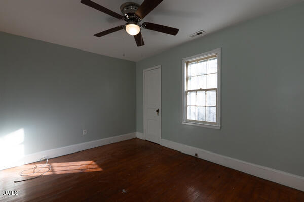 2525 Freeman Street Fayetteville, NC 28301 - Photo 15 of 24 an empty room with a window and a fan