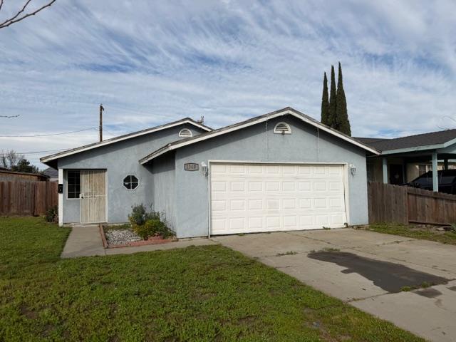 1340 Bennett Avenue Dos Palos, CA 93620 - Photo 1 of 16 a house view with a garden space
