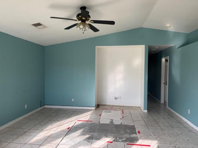 1340 Bennett Avenue Dos Palos, CA 93620 - Photo 5 of 16 a bedroom with a bed and a chandelier fan