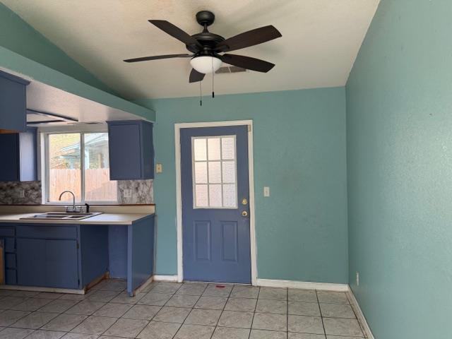1340 Bennett Avenue Dos Palos, CA 93620 - Photo 8 of 16 a view of a kitchen with a sink and a window