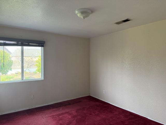 1340 Bennett Avenue Dos Palos, CA 93620 - Photo 9 of 16 an empty room with a window