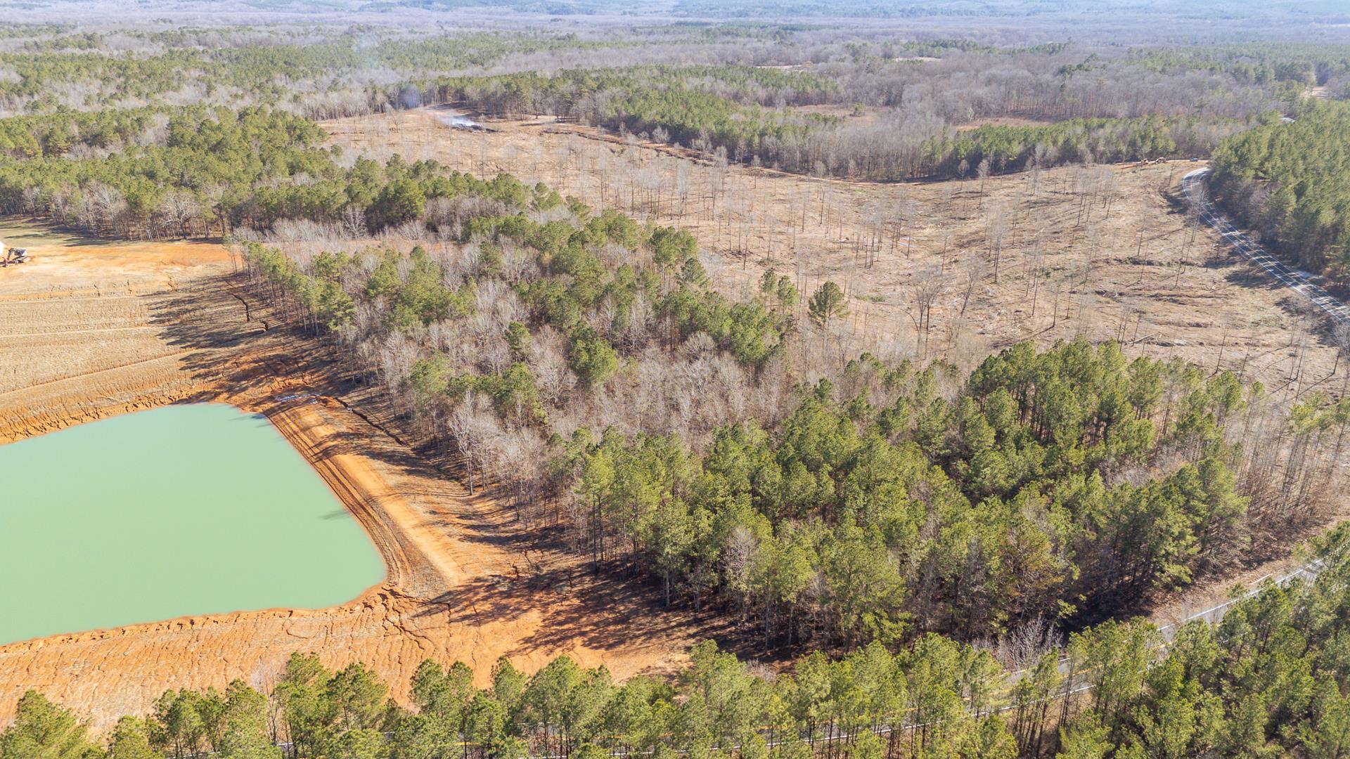 0 Kendrick & Hamburg Road Michie, TN 38357 - Photo 7 of 38 Aerial view of a nearby body of water and a heavily wooded area