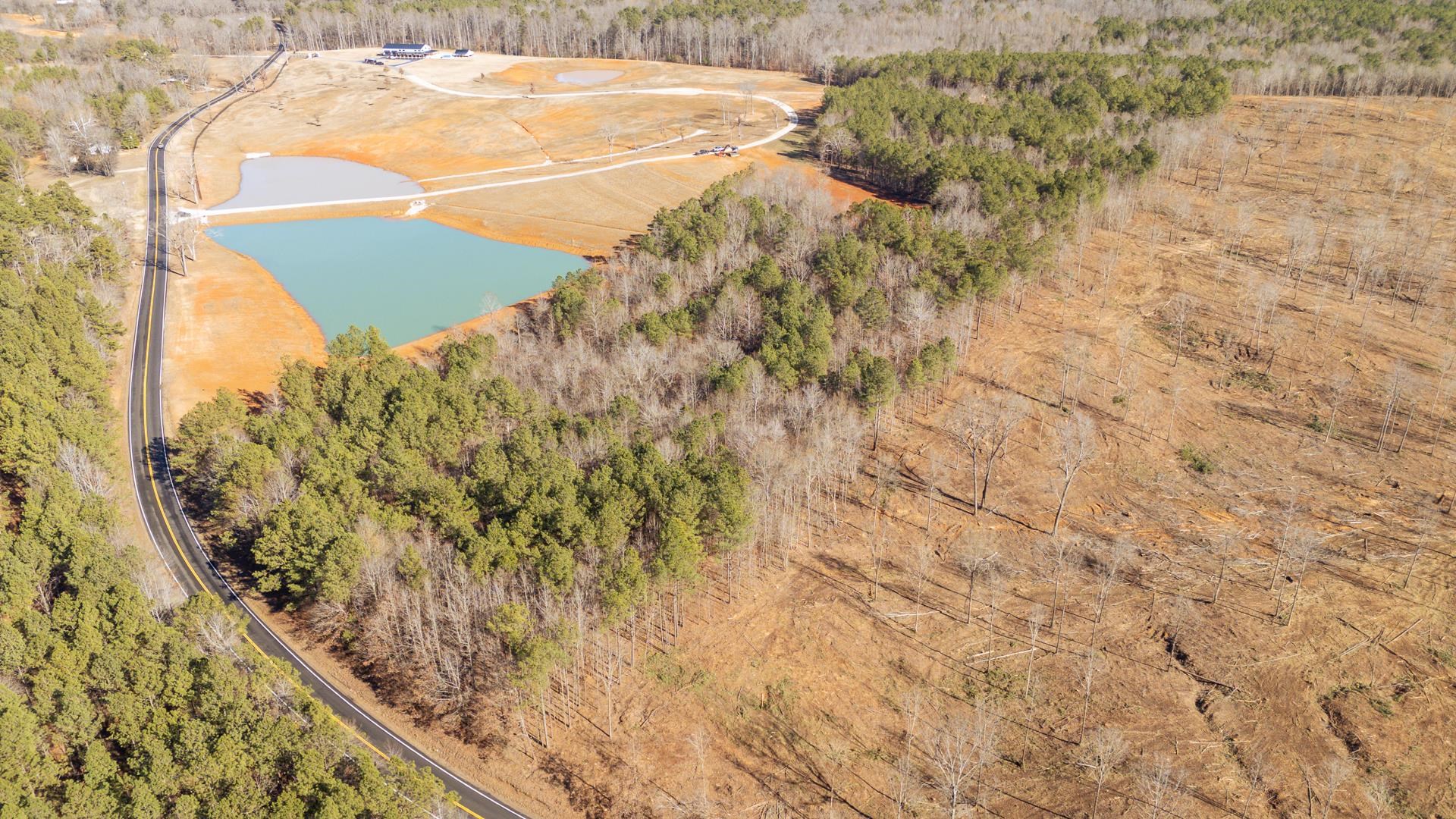 0 Kendrick & Hamburg Road Michie, TN 38357 - Photo 10 of 38 Bird's eye view of a nearby body of water and a heavily wooded area